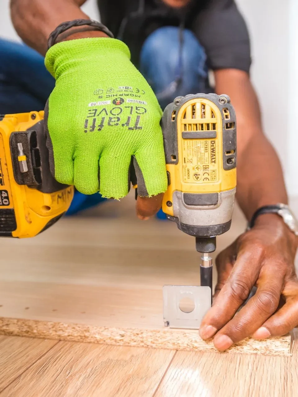 Maintenance technician working with power drill
